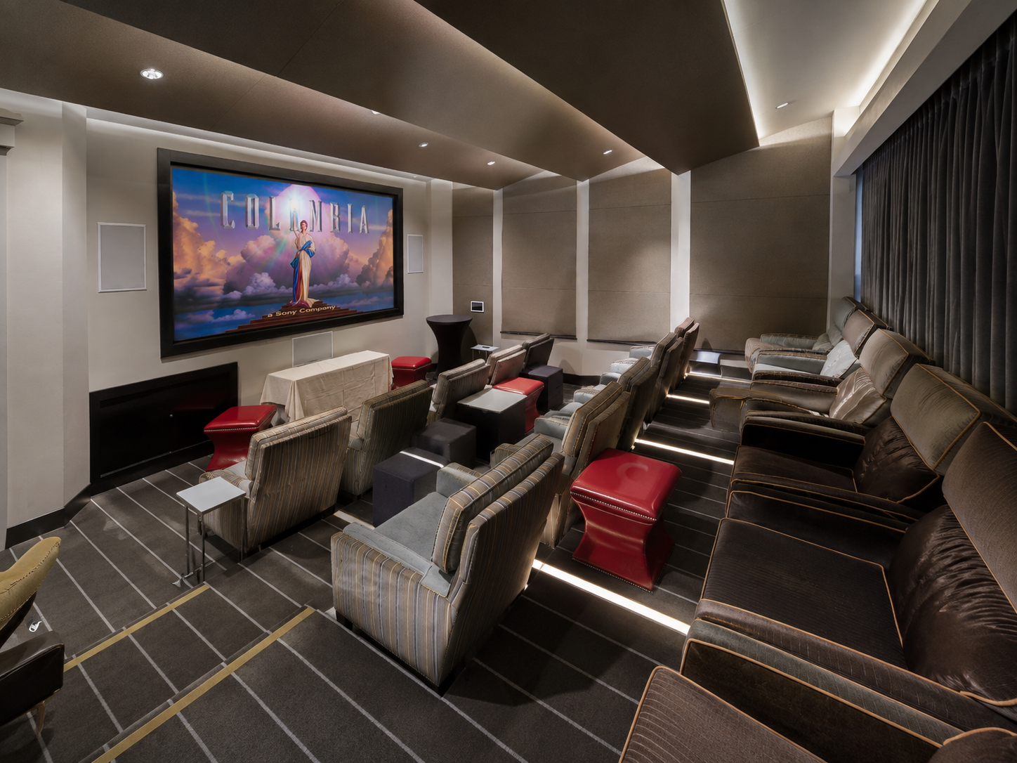 Audience watching a film in a cinema screening room